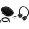 HP UC Wireless Duo Headset with USB charging cable, dongle and case, center front facing (Left facing)